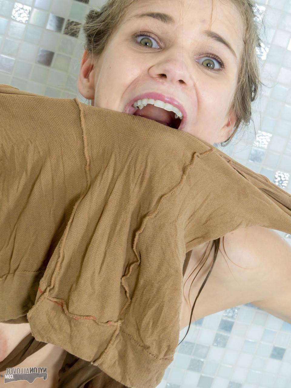 16P Cute girl Sarah Kay gets entangled in layers of hose while in a bathtub