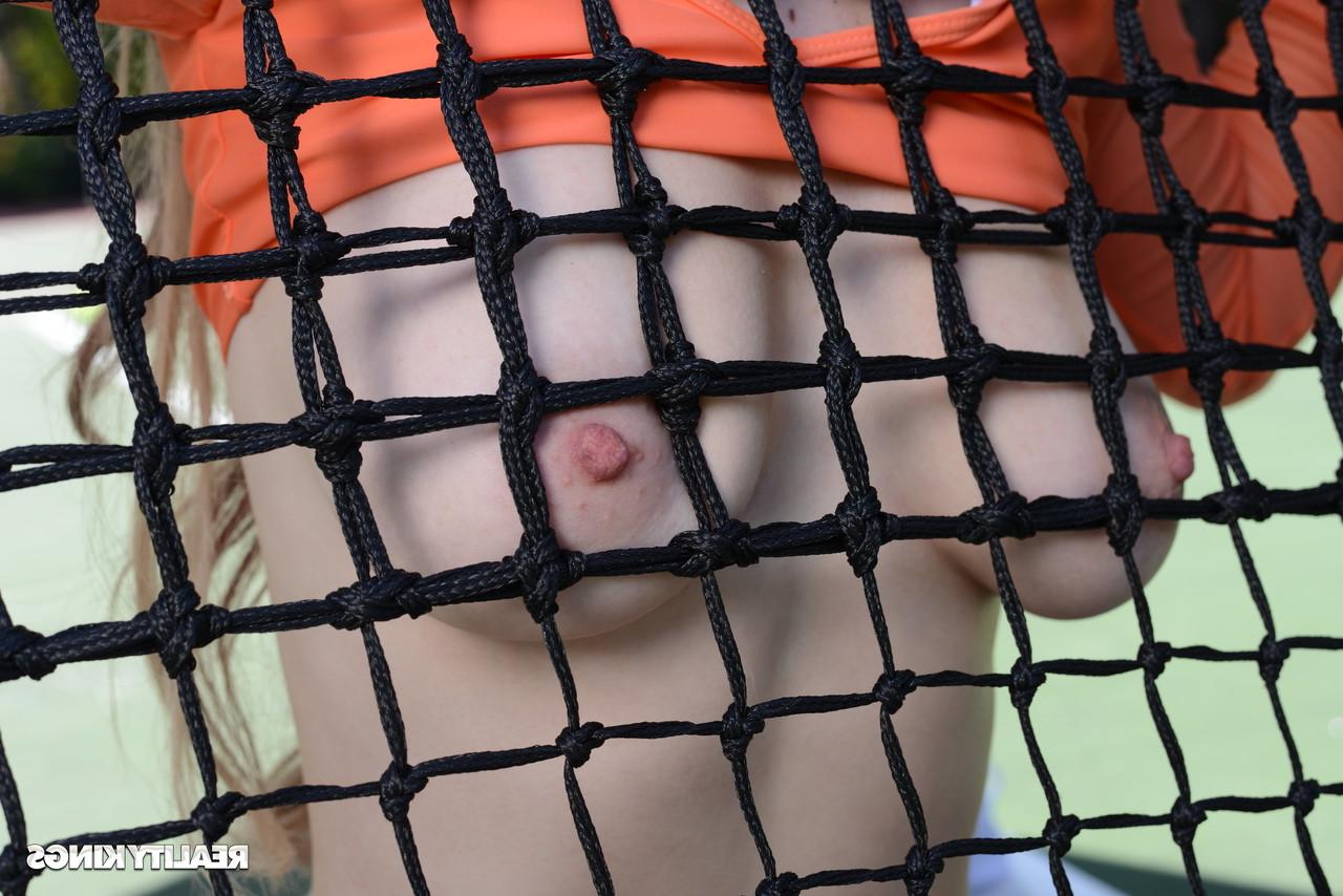 20P Sexy tennis babe Kara Lee undresses and takes her opponent's dick on the court