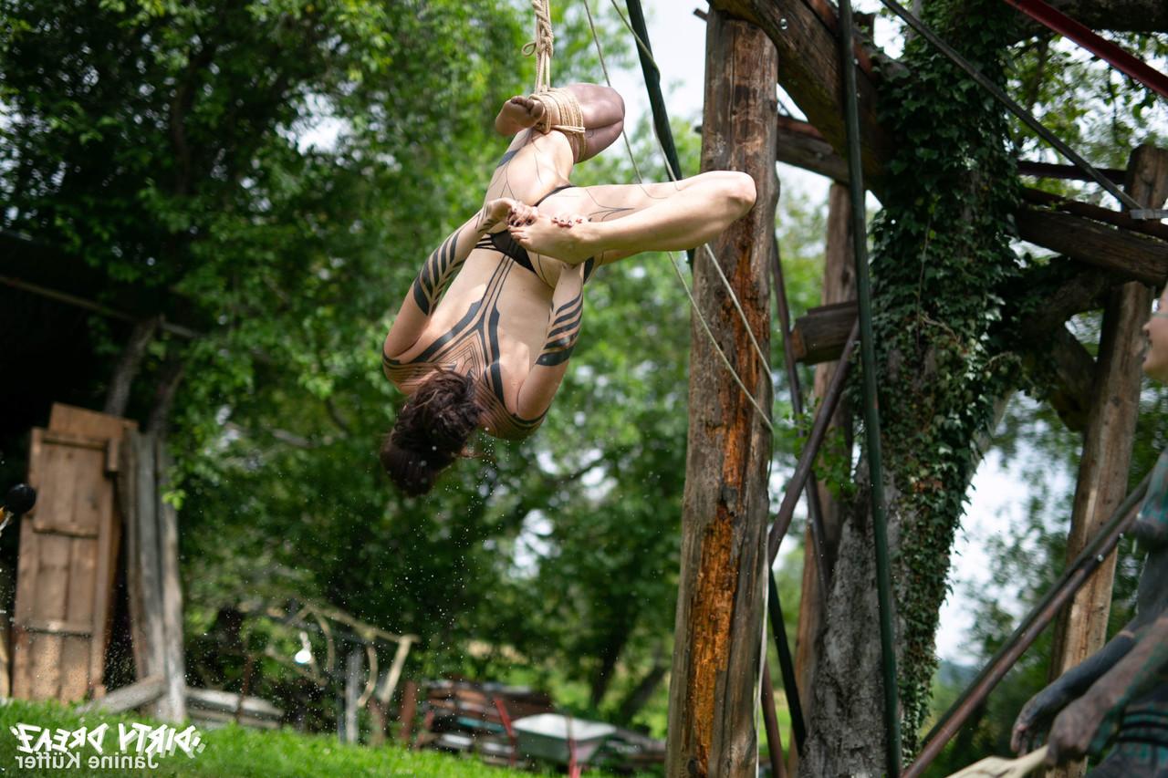 16P Naked girls are suspended from a backyard tree with block and tackle