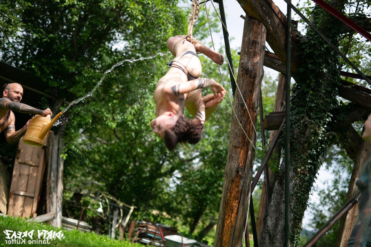 16P Naked girls are suspended from a backyard tree with block and tackle