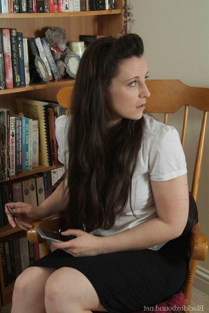16P Brunette woman struggles against rope bindings in a rocking chair
