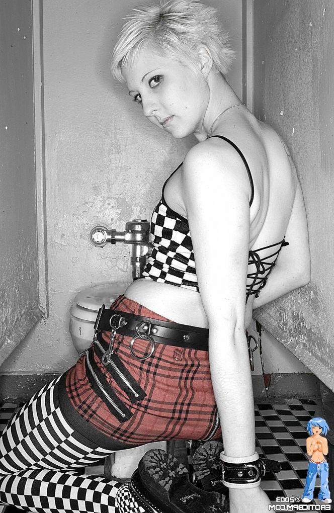 15P Sexy girl with short blonde hair Watts disrobes on top of a public toilet