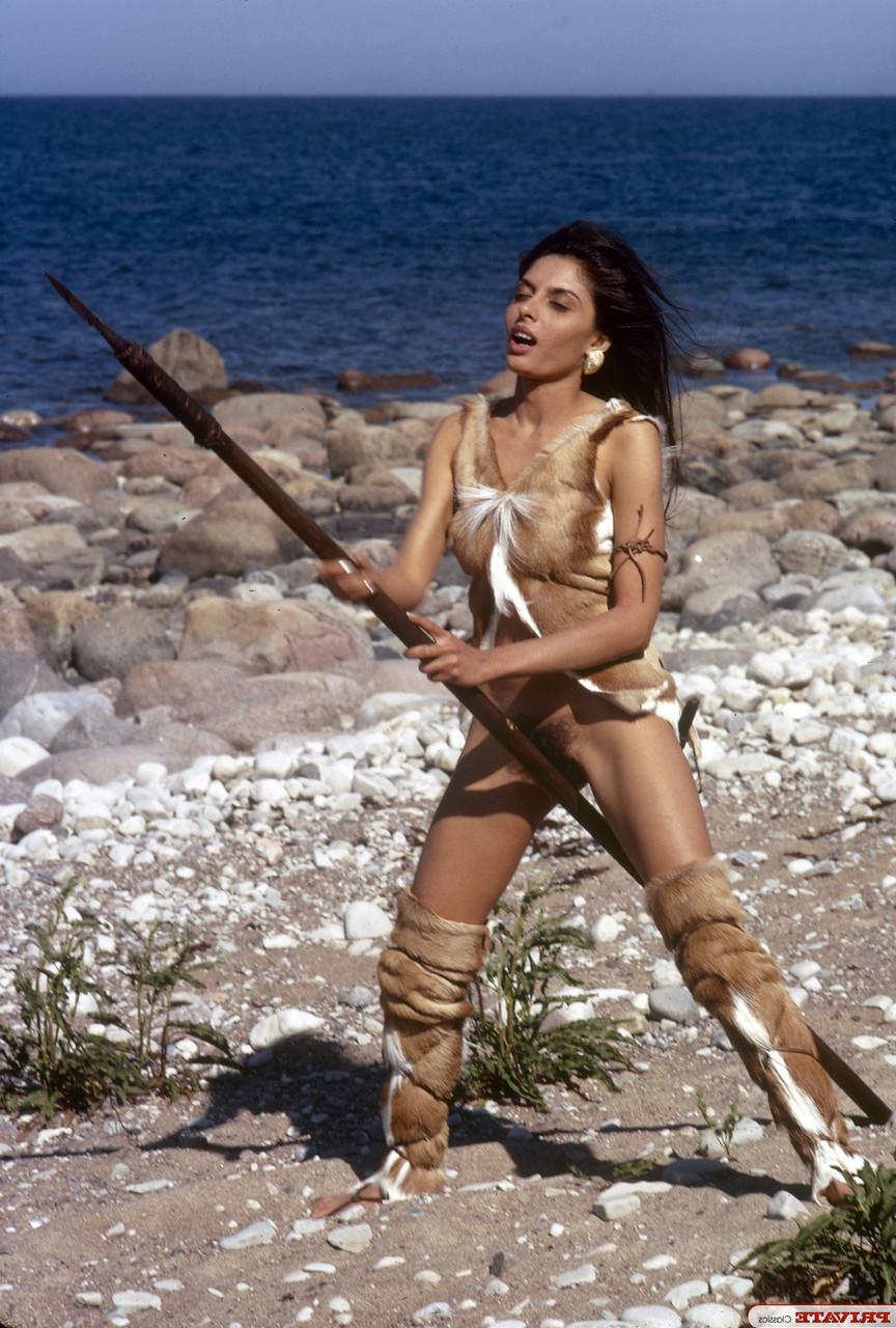 15P Brunette chick in Wildling attire is caught masturbating in nature