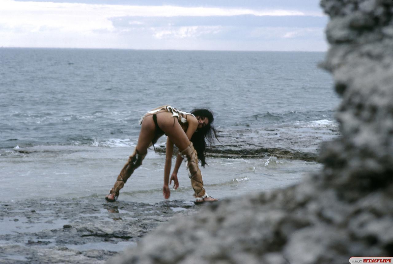 15P Brunette chick in Wildling attire is caught masturbating in nature