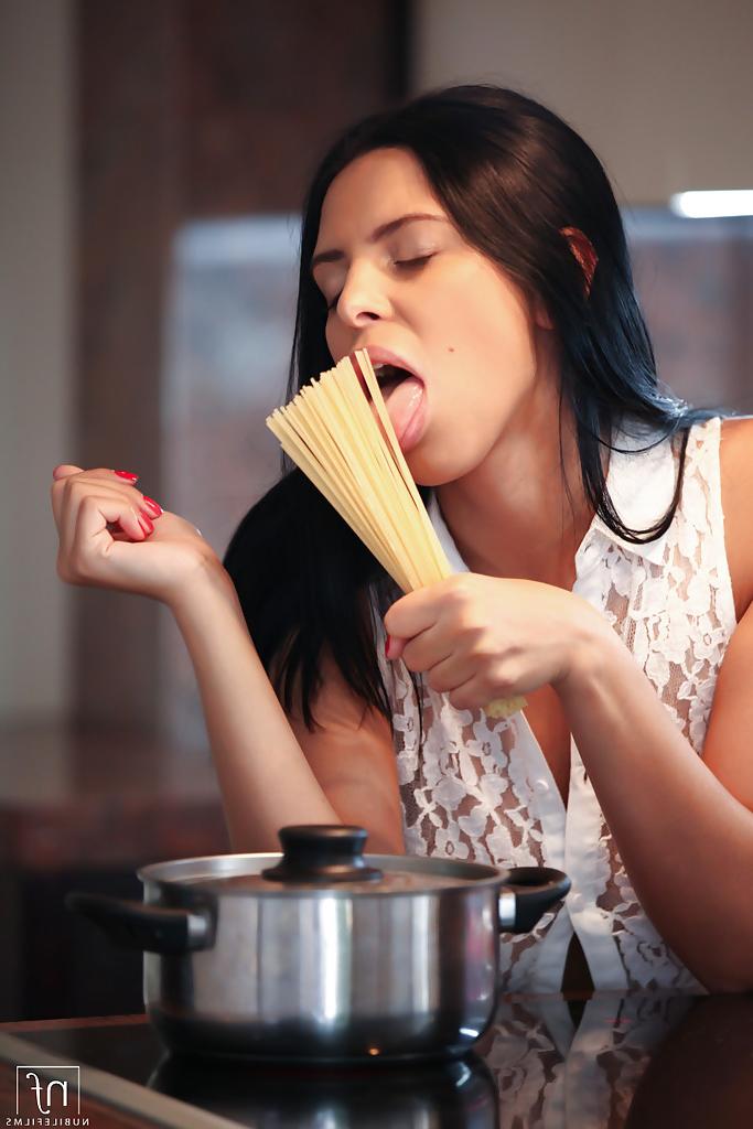 16P Brunette Elena Rae is cooking and playing with her nice nipples