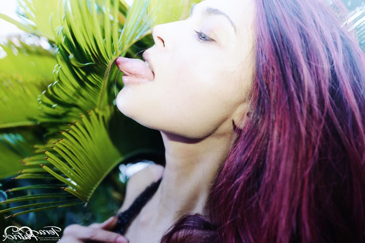 17P Asian MILF Tera Patrick models in the nude during a rooftop shoot