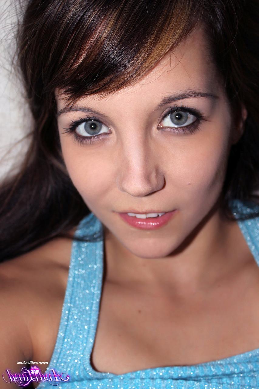 15P Young brunette Andi Land fingers and toys her asshole during solo action