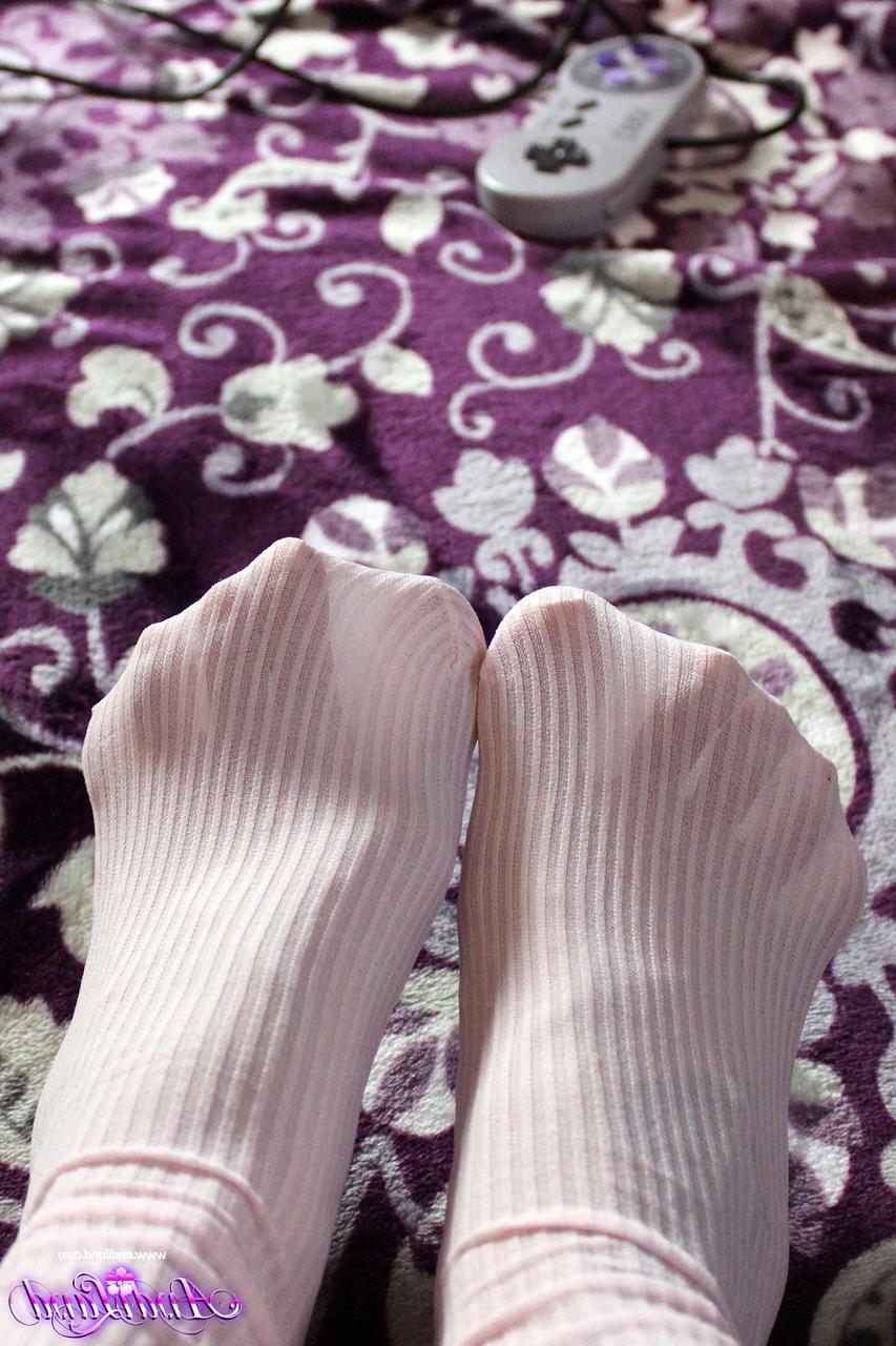 15P Young girl Andi Land slides her underwear aside while gaming in OTK socks